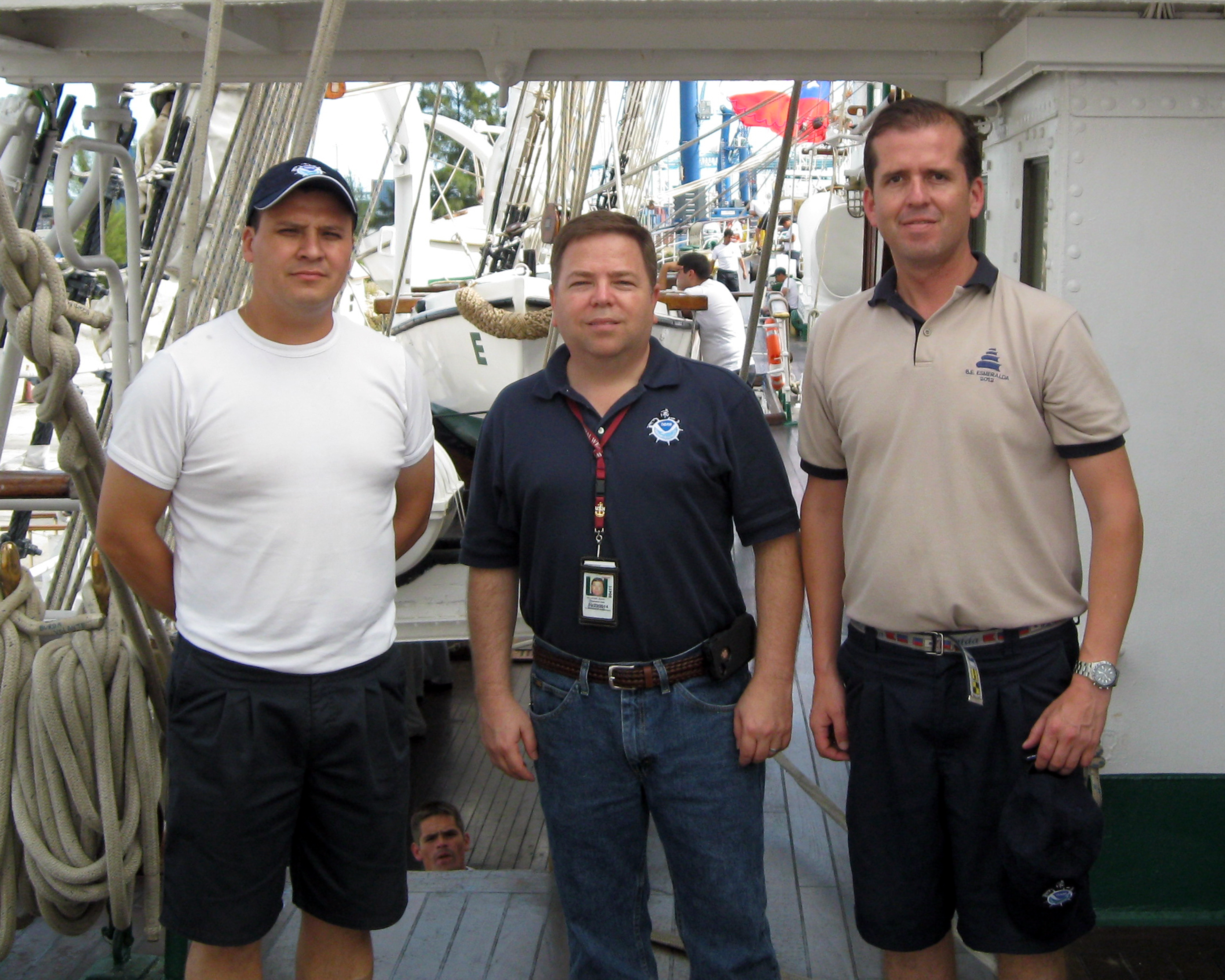From left to right: Corporal Miguel Pulgar, the Met NCO, Dave Dellinger, and Lieutenant Commander Patricio Acevedo, the ship's Operations Officer.